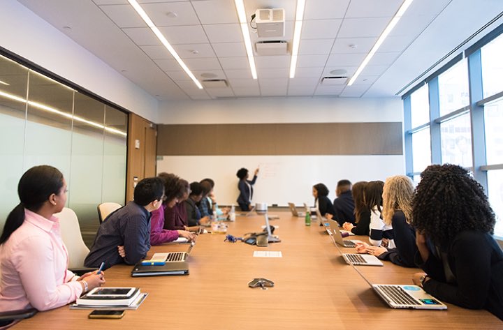 Writers around a conference table during a masterclass